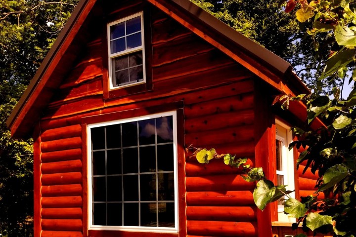 small log cabin with windows