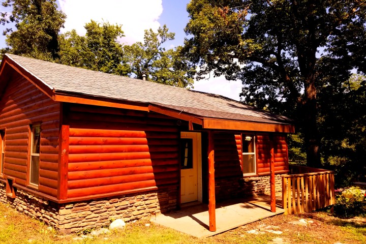log cabin with small porch
