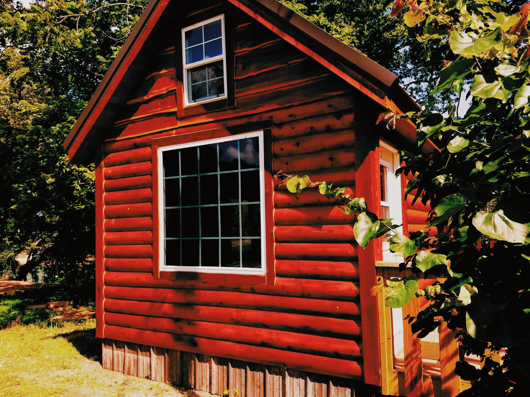 a red bench in front of a house