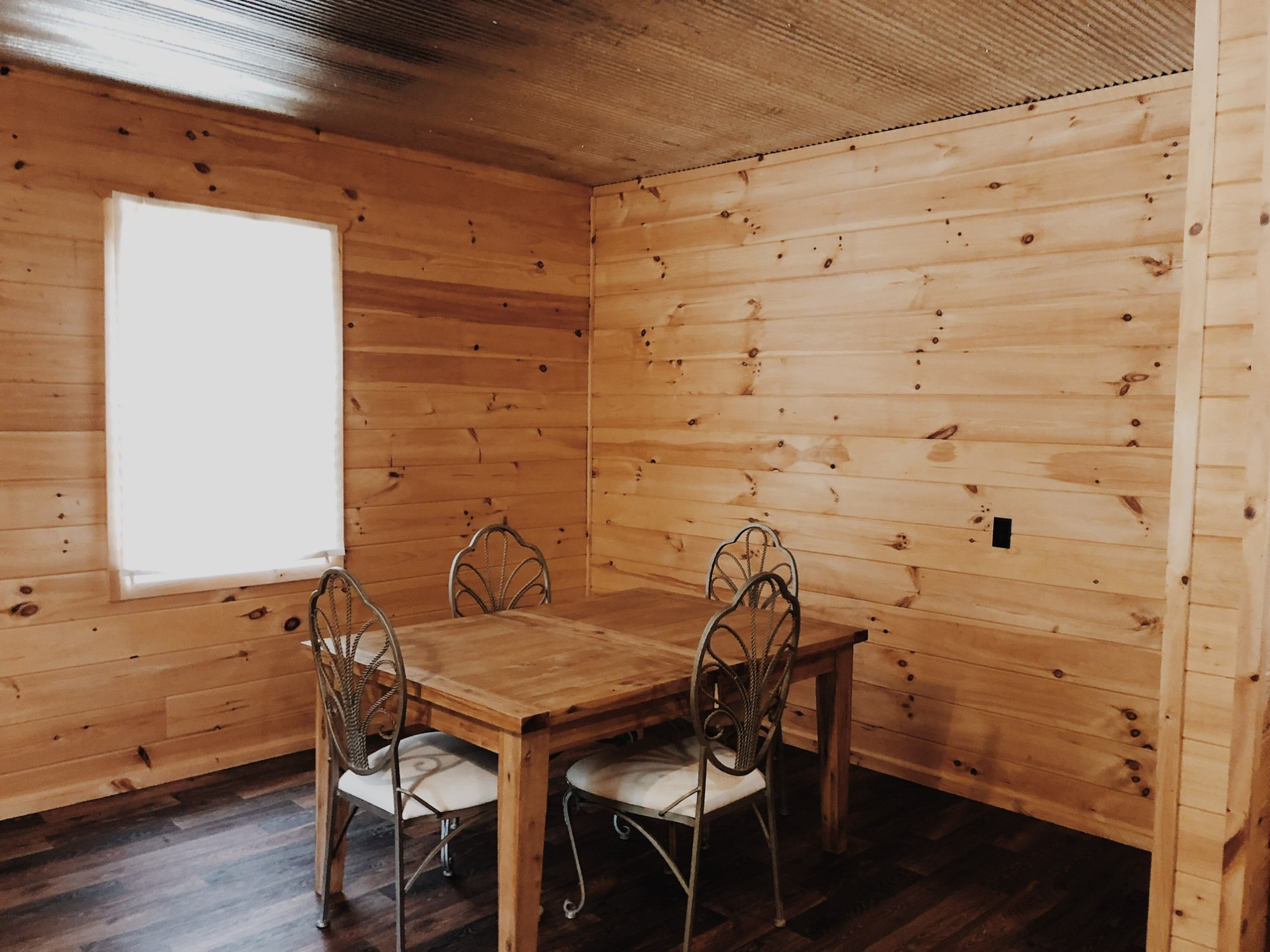 a wood bed in a room