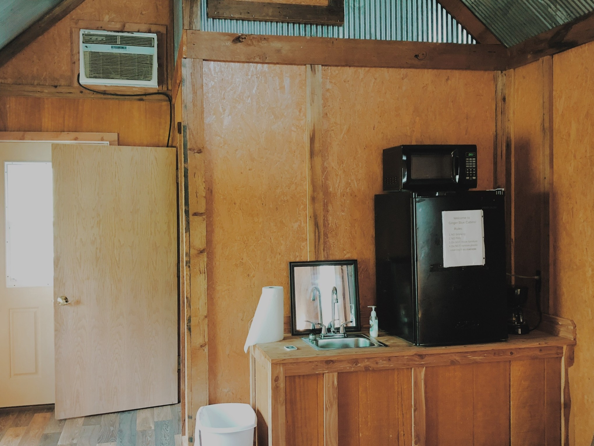 a kitchen with wooden cabinets