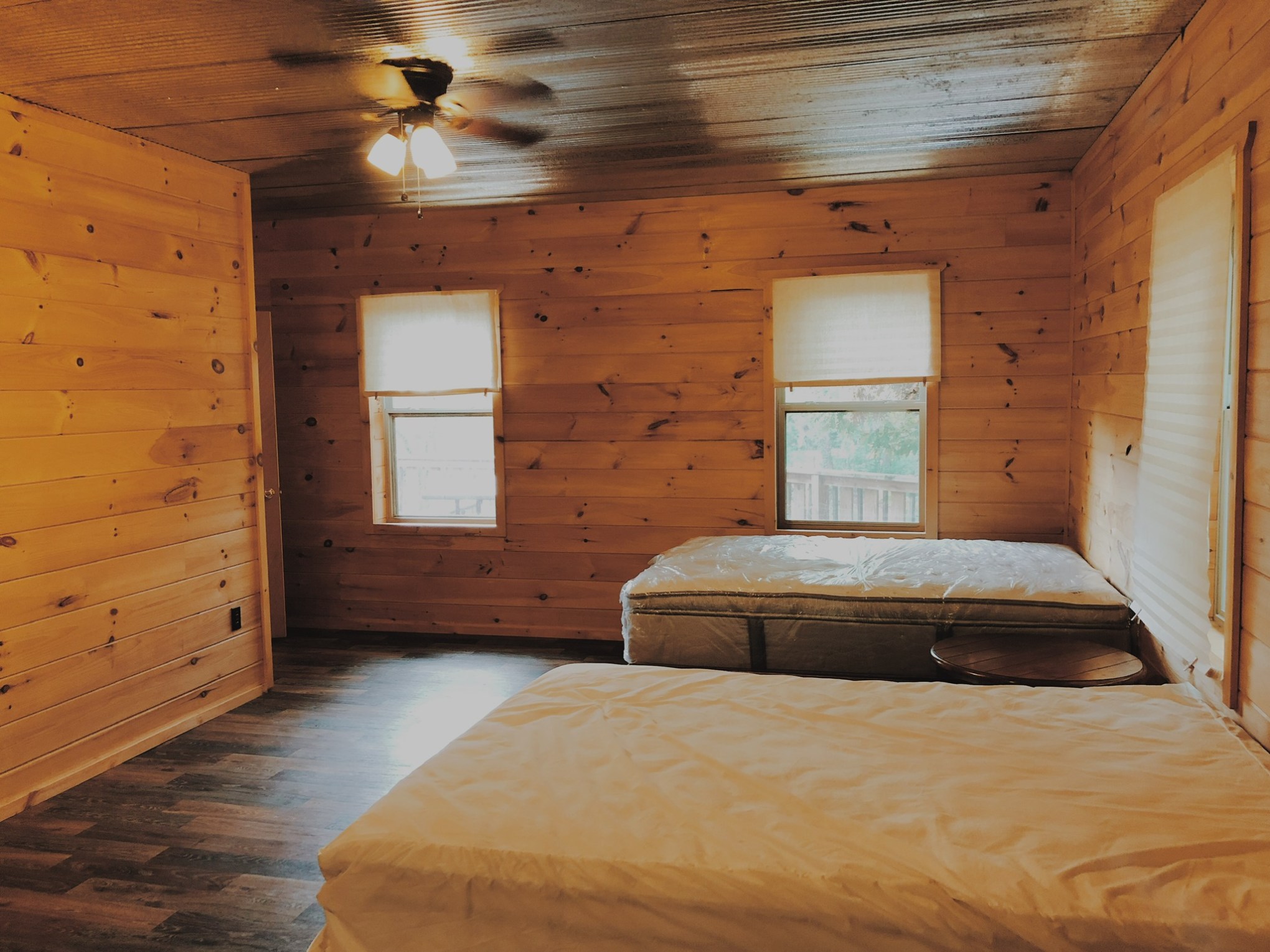 a bedroom with a bed in a room