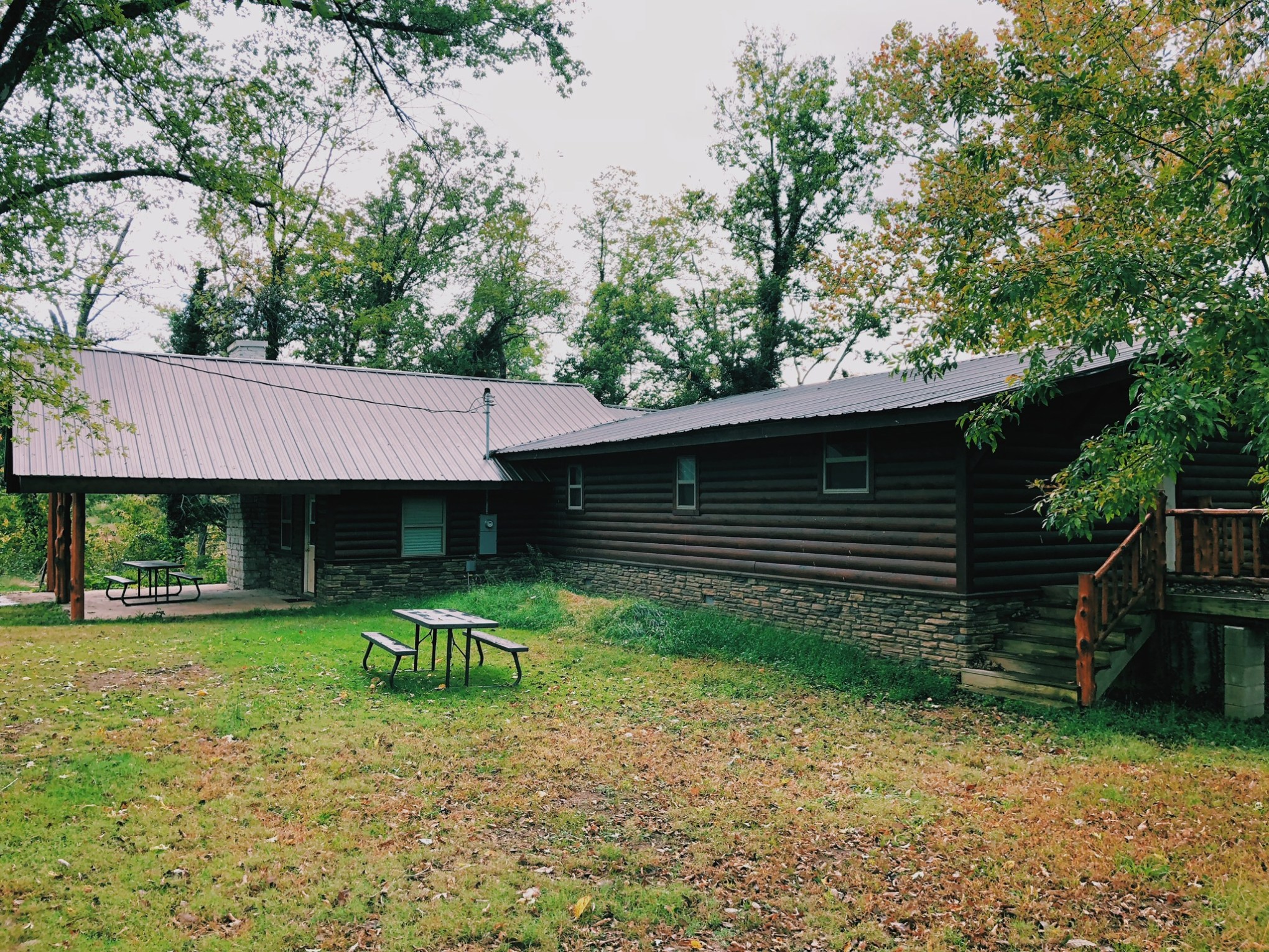 a house with trees in the front yard