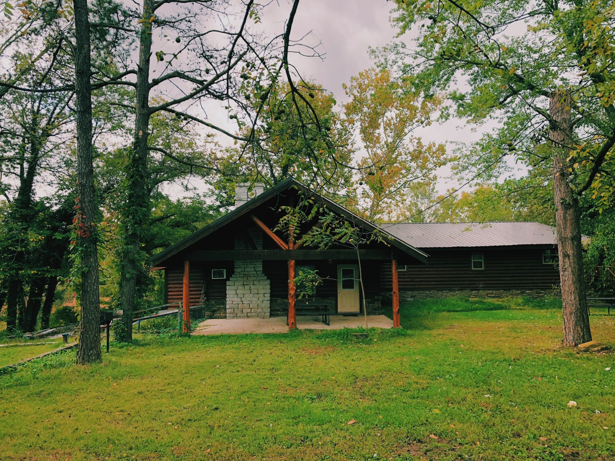a house on top of a lush green field