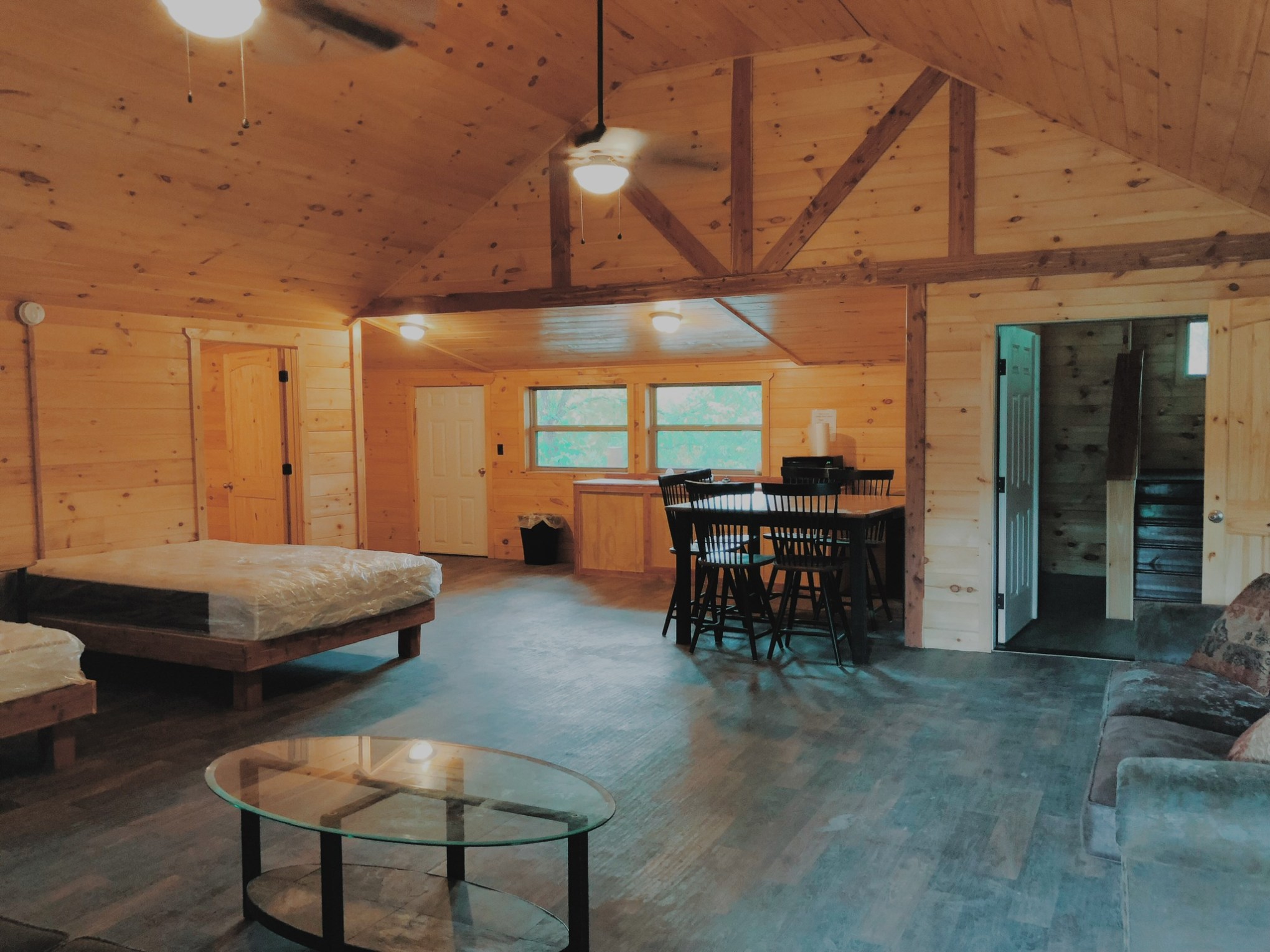 a room filled with furniture on top of a wooden table