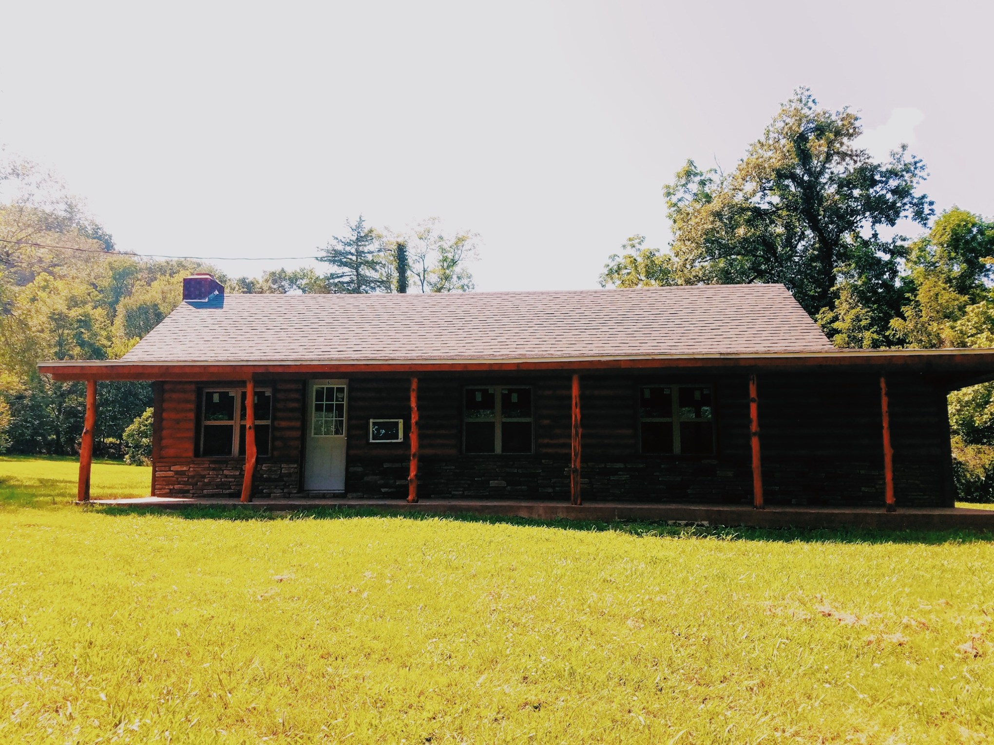 a yellow school bus parked in a field
