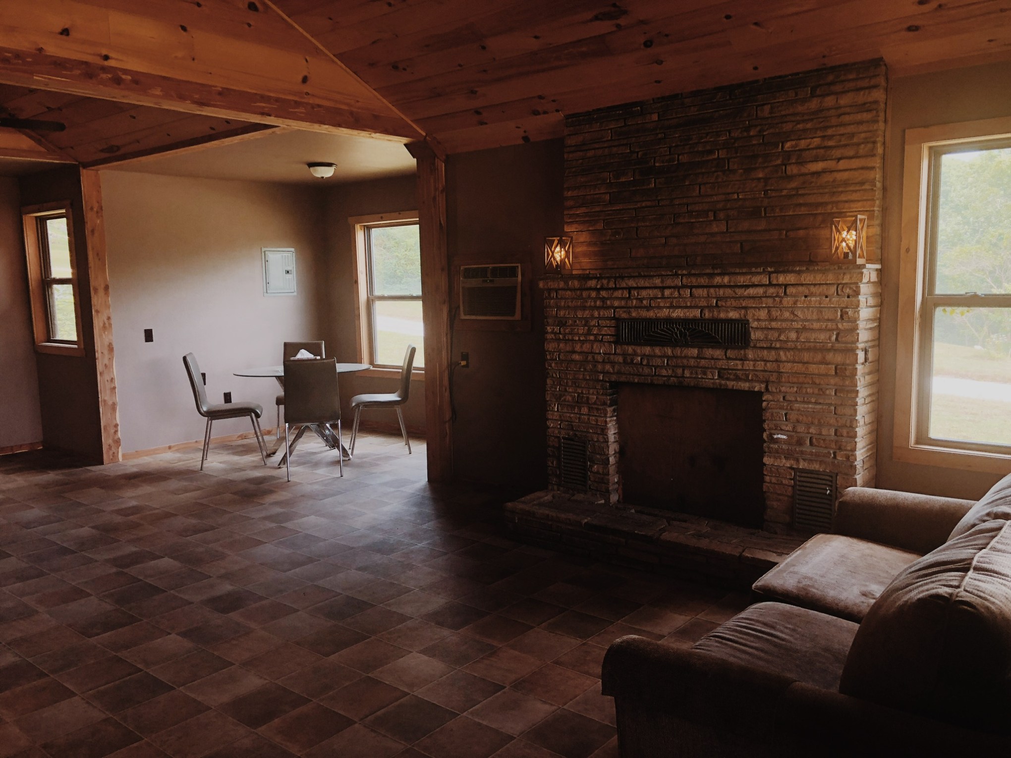 a living room filled with furniture and a large window