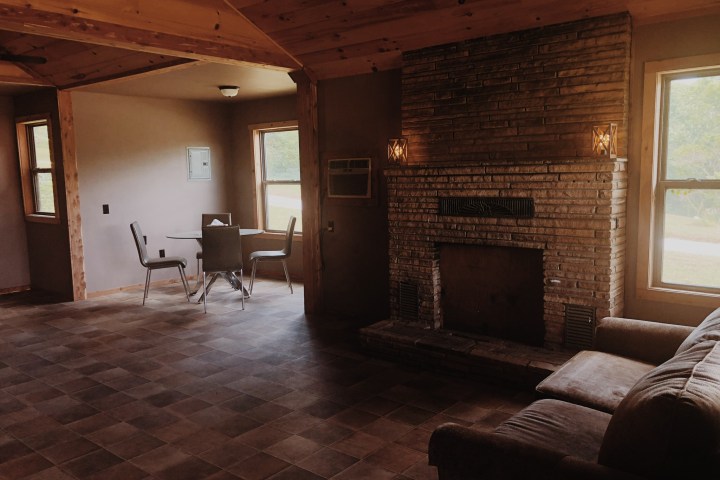 a living room filled with furniture and a large window