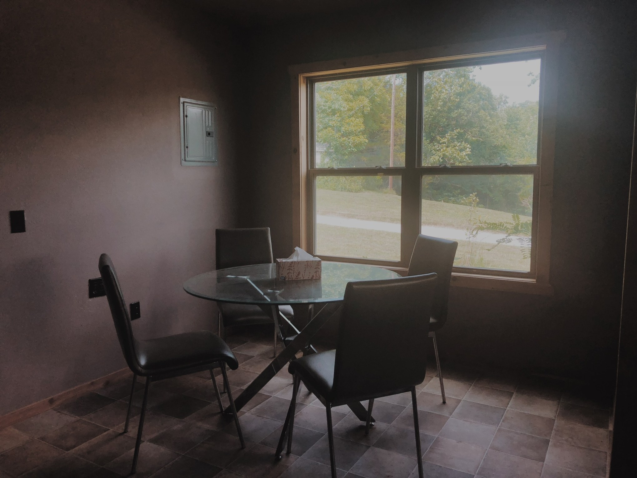 a room filled with furniture and a large window