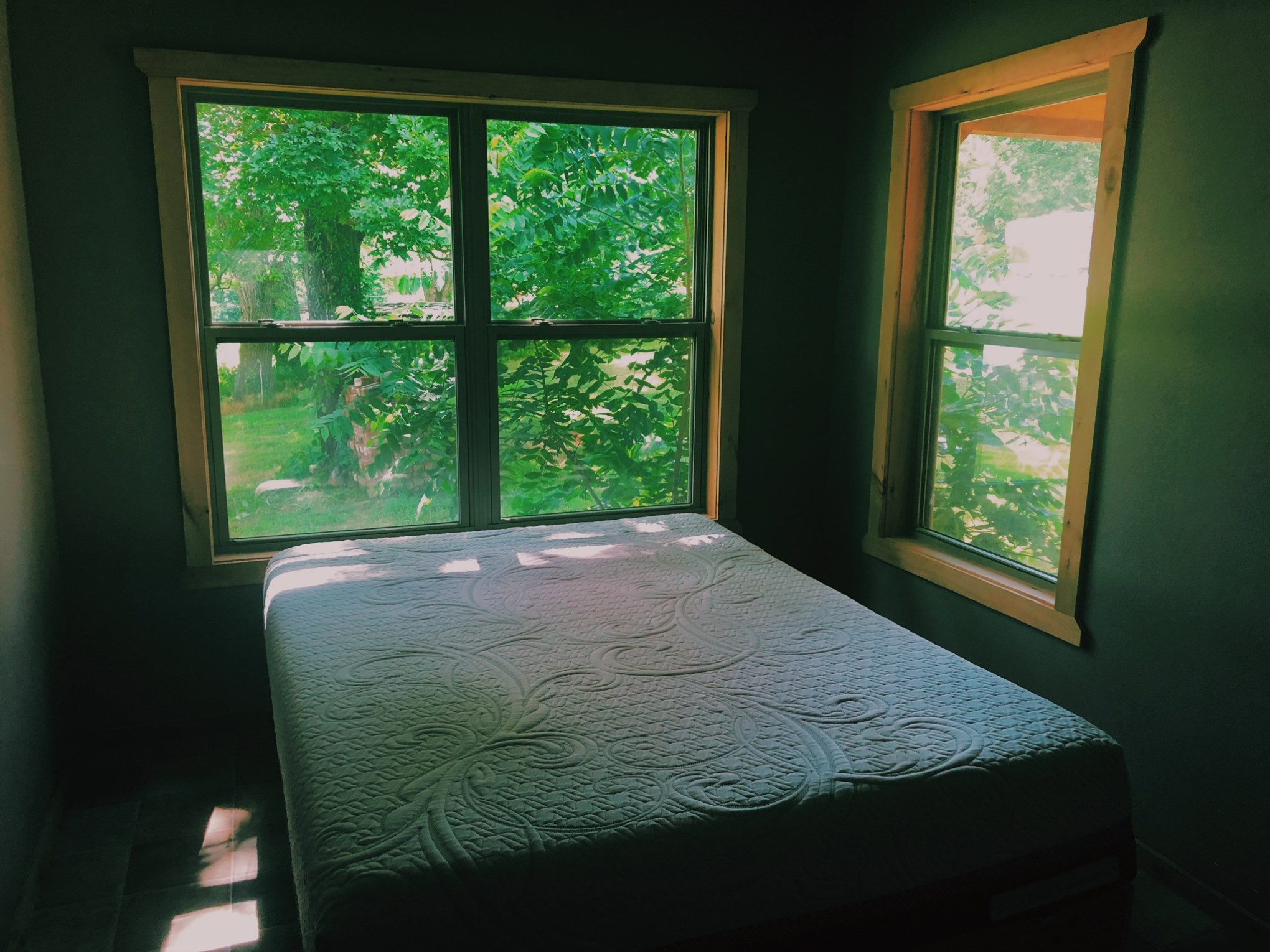 a bedroom with a large window