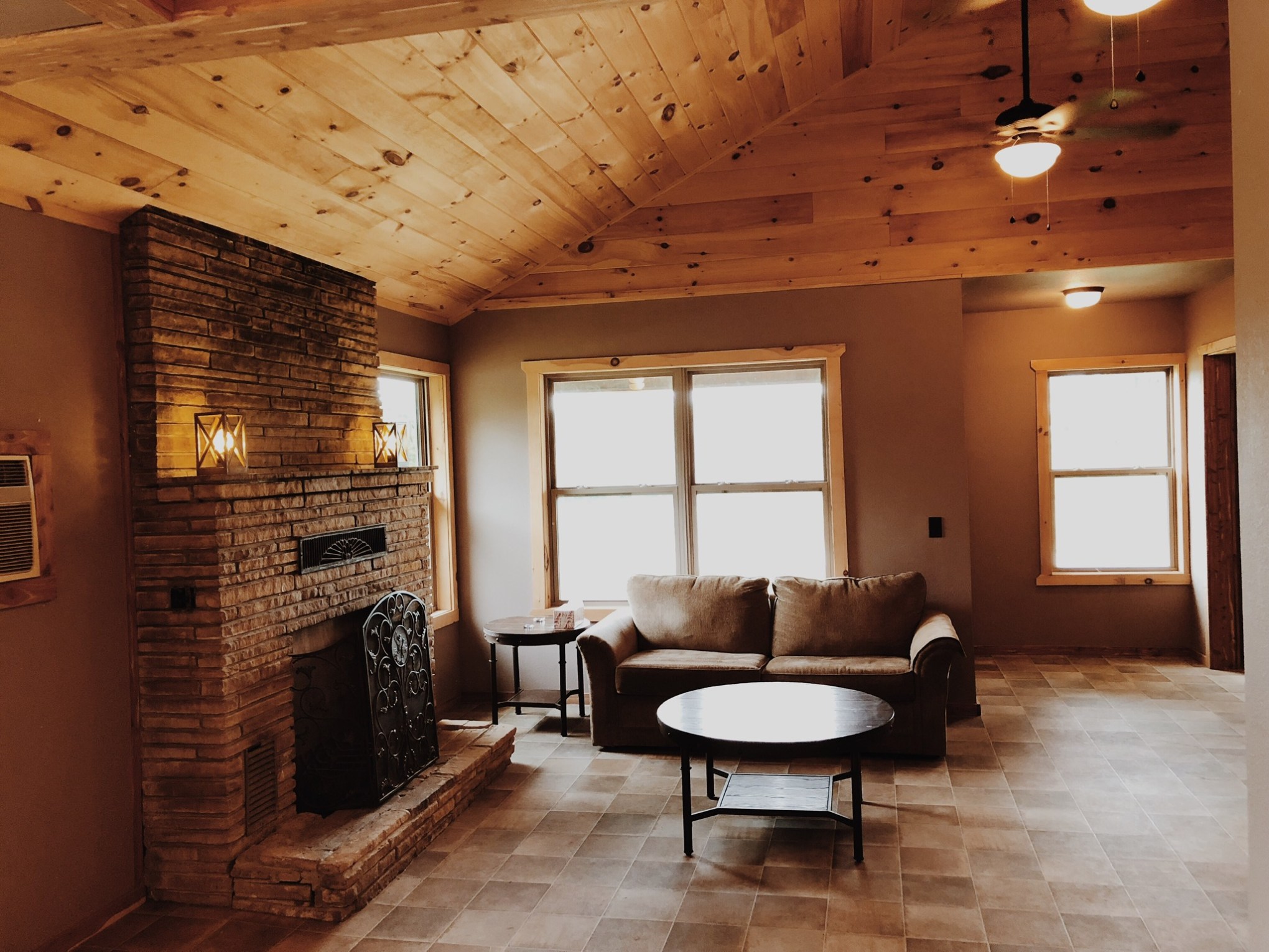 a living room filled with furniture and a large window