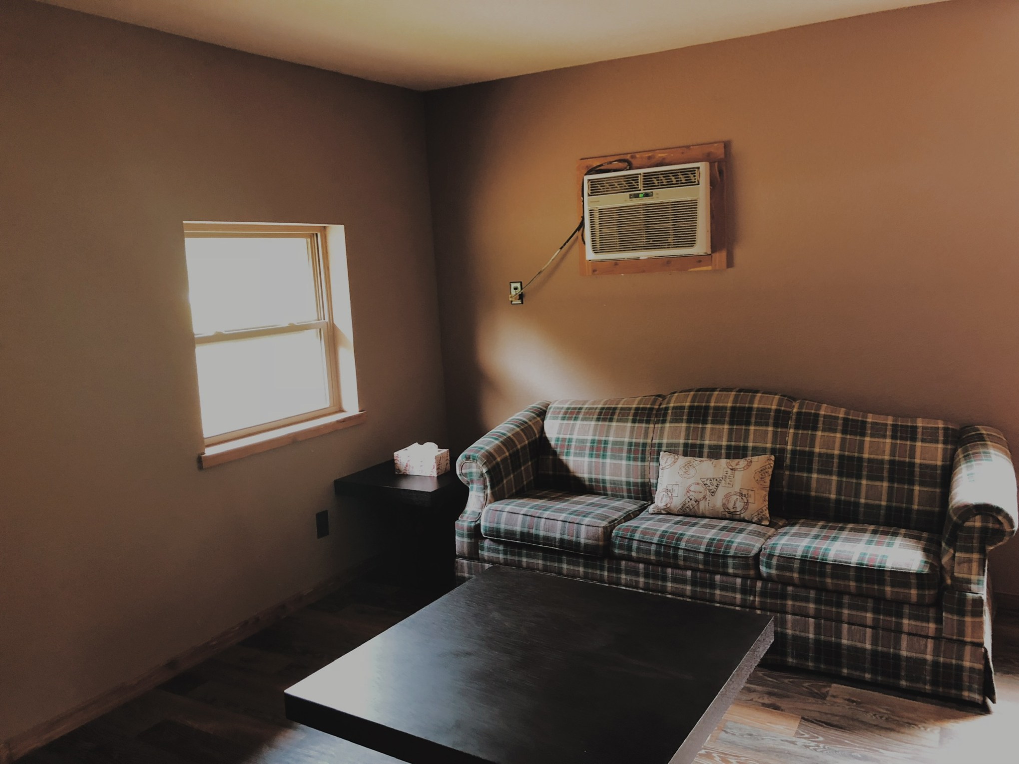 a bedroom with a bed in a room