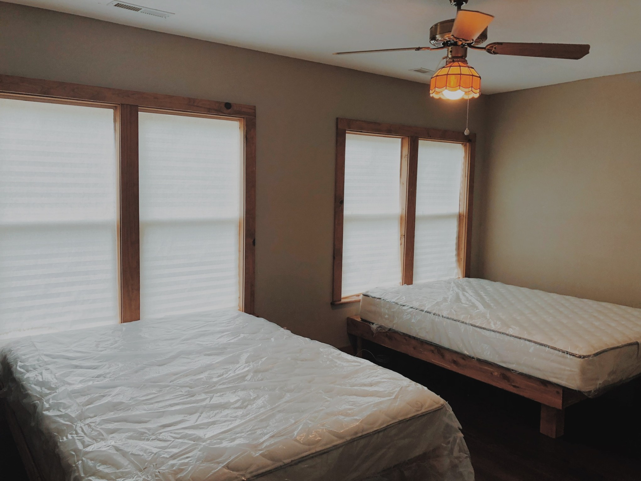 a bedroom with a bed in a room