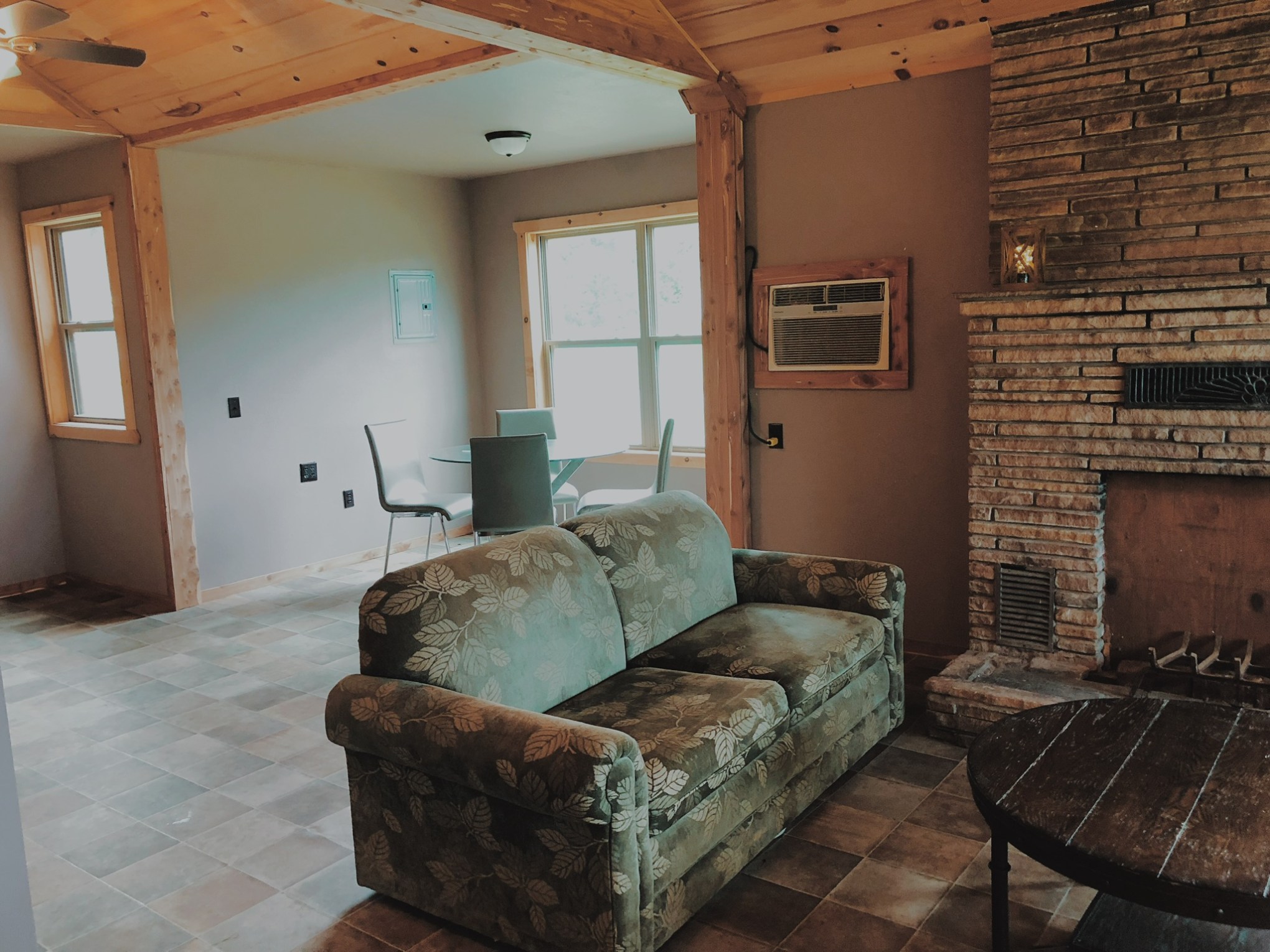 a living room filled with furniture and a fireplace
