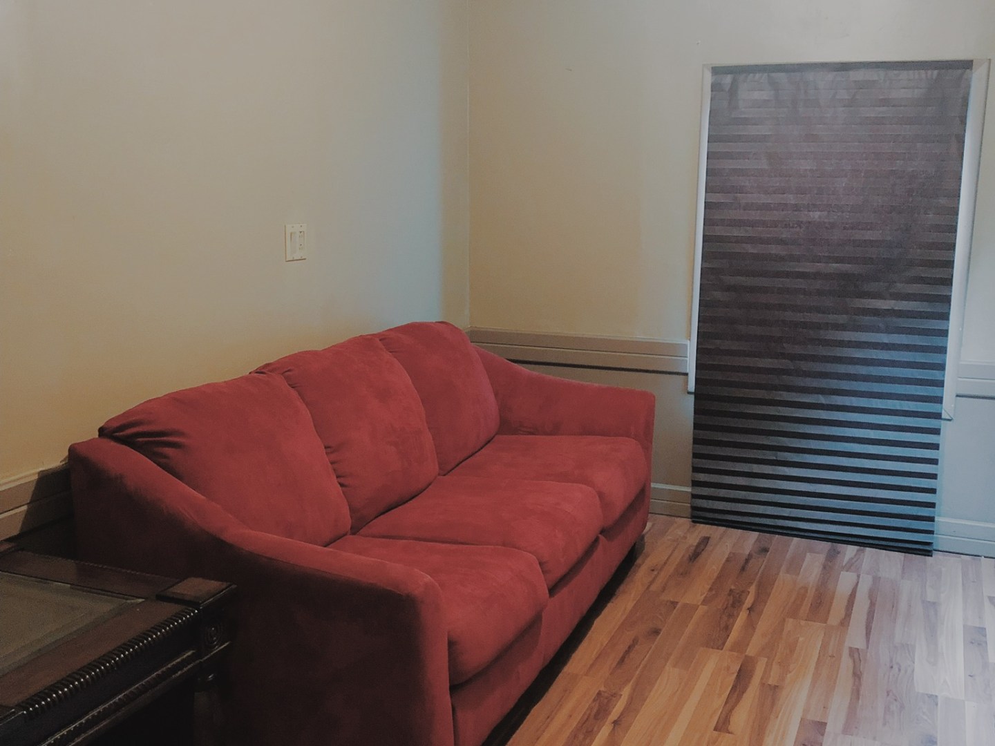 a living room with red floor