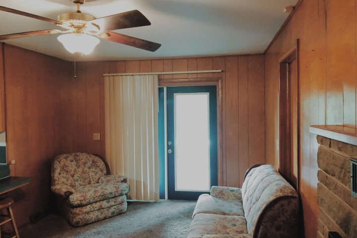 a room filled with furniture and a fireplace