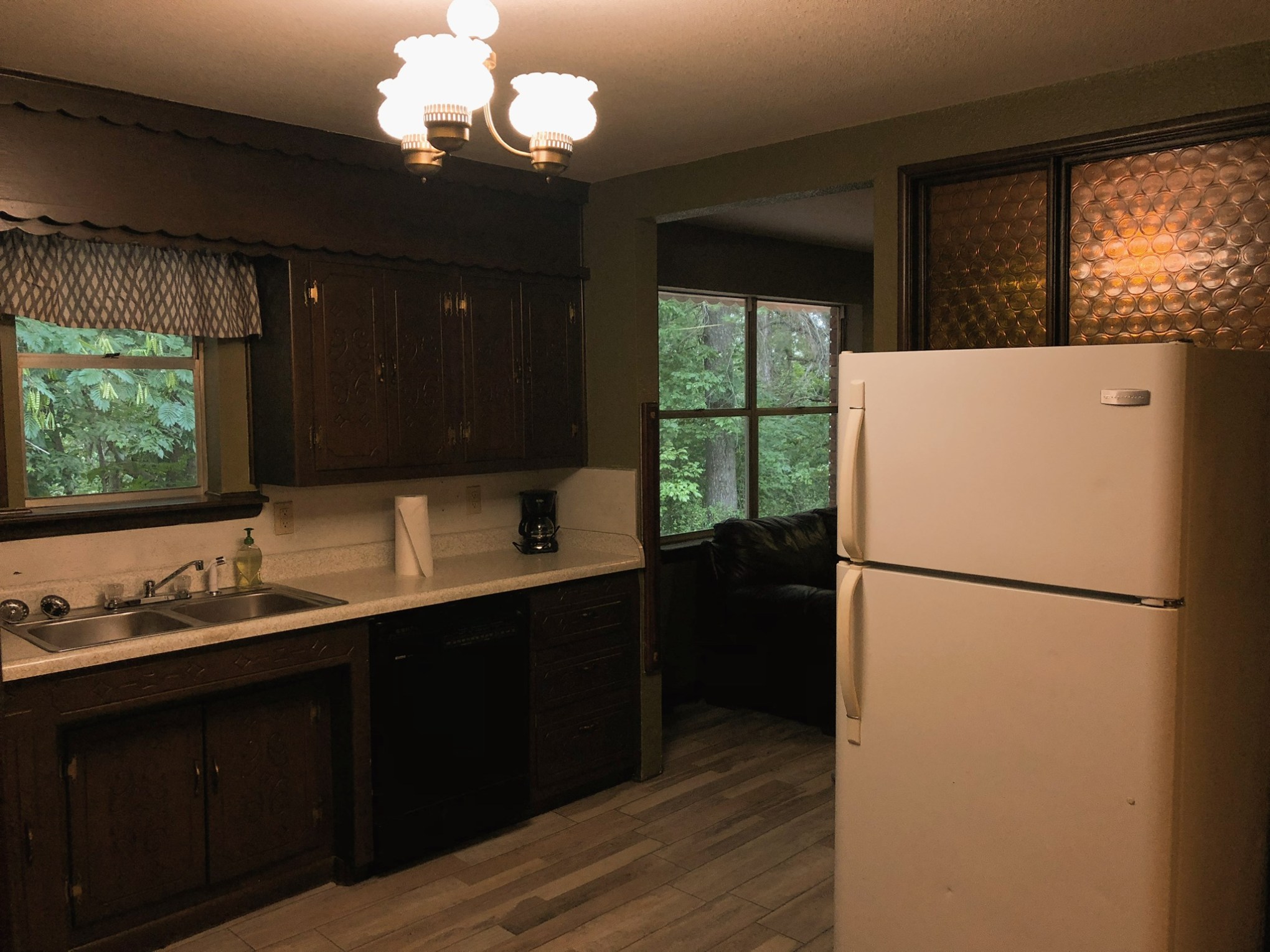 a large white refrigerator in a kitchen