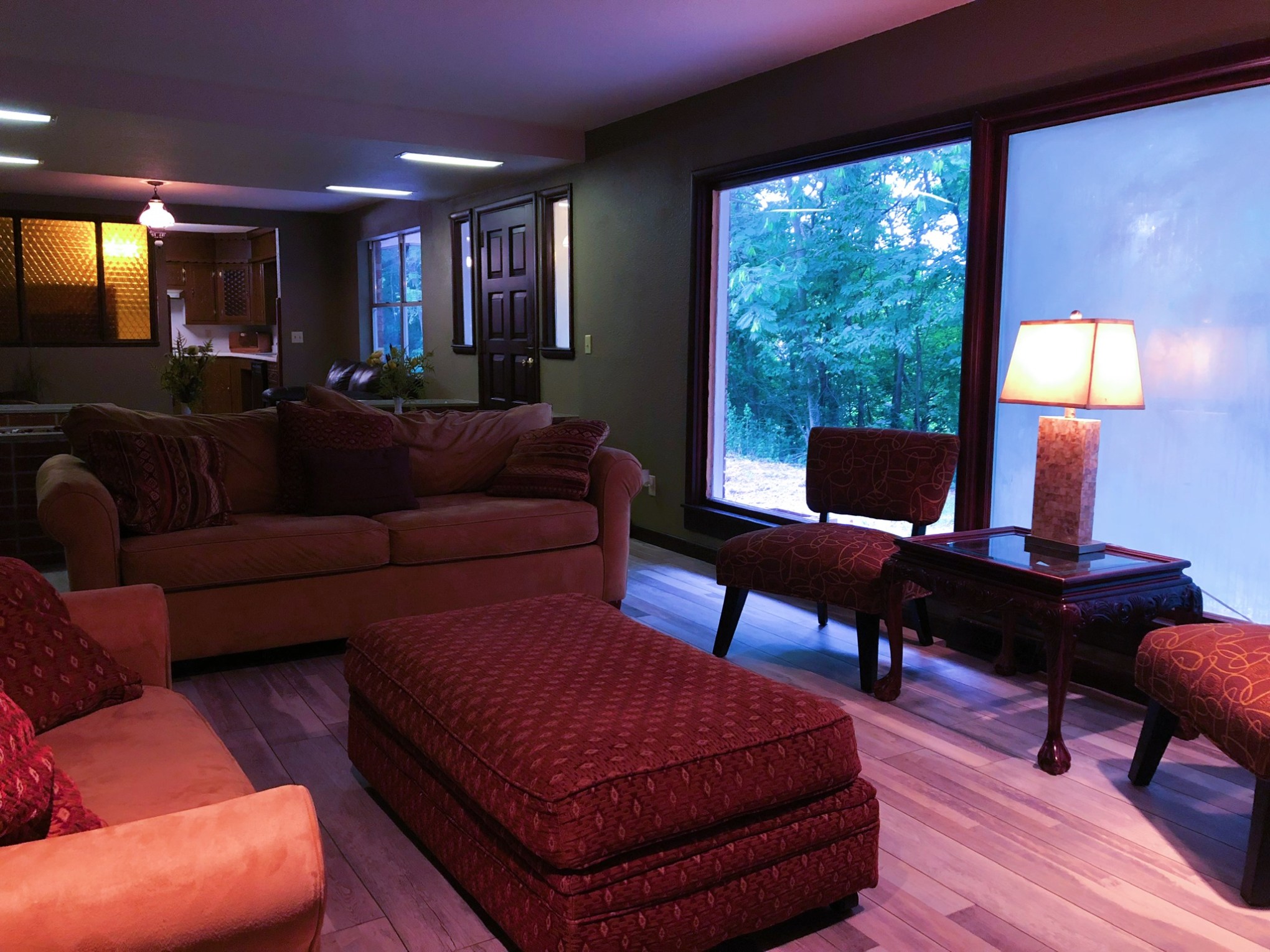 a living room filled with furniture and a flat screen tv