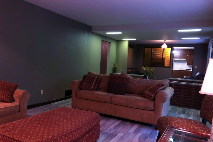 a bedroom with a bed in a room