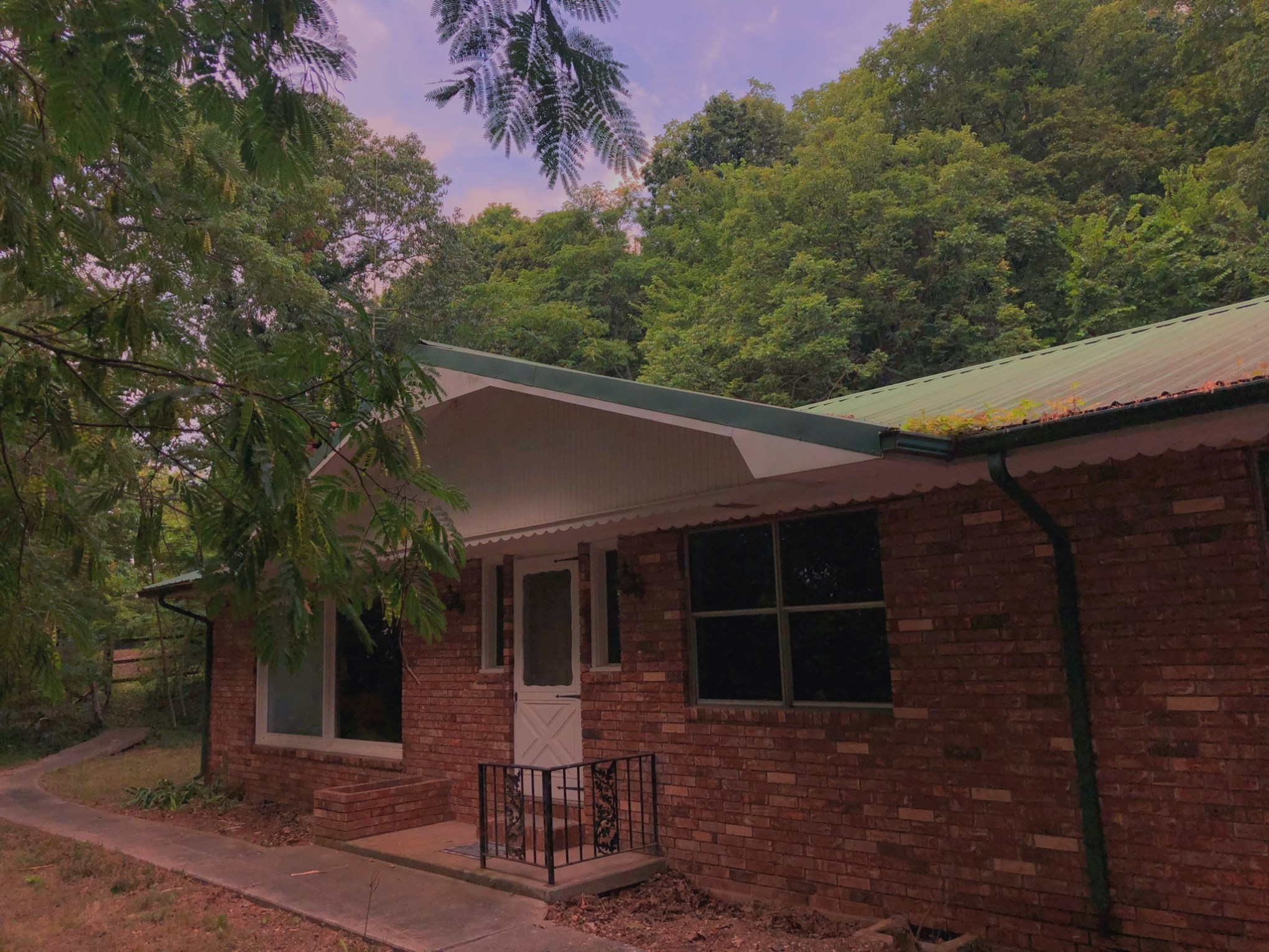 a bench in front of a brick building