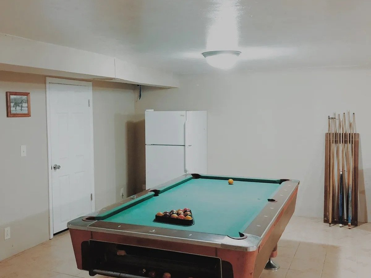 a kitchen with a table in a room