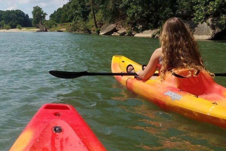a person riding a surf board on a body of water